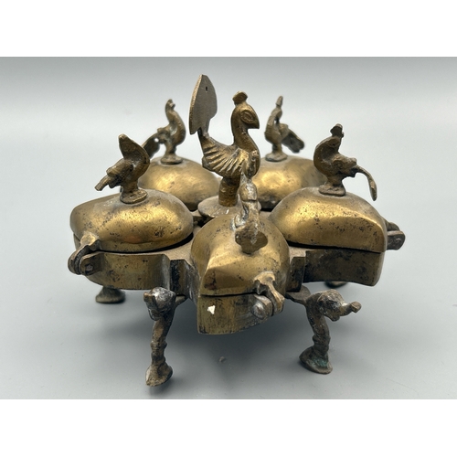 64 - A vintage Indian brass spice dish decorated with Peacocks on Elephant feet, 8cm high, 11cm diameter,... 