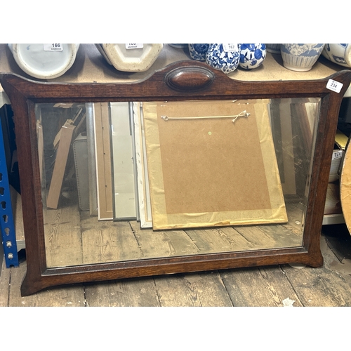 234 - Vintage bevelled mirror in wood frame, 77 x 44cm