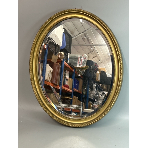 235 - Oval bevelled mirror, 46 x 58cm