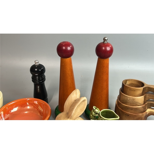 12 - Assorted kitchenware including wooden salt & pepper mills, Moorcroft orange bowls and Sylvac Rabbit ... 