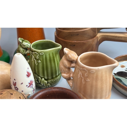 12 - Assorted kitchenware including wooden salt & pepper mills, Moorcroft orange bowls and Sylvac Rabbit ... 