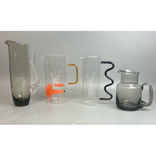 8 - Four modern glass jugs including Habitat and a Wedgwood lead crystal smoke glass jug by Frank Throwe... 