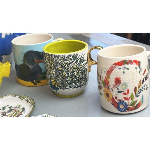 9 - Assorted colorful kitchenware including mugs, storage jar, jug and dishes (17) / T7