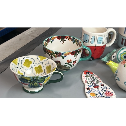 9 - Assorted colorful kitchenware including mugs, storage jar, jug and dishes (17) / T7