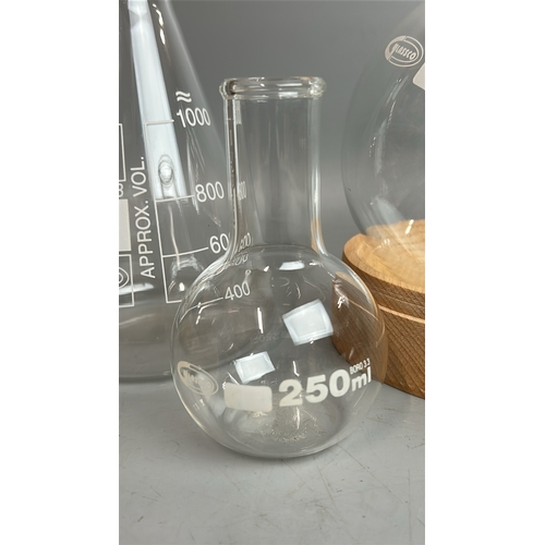 28 - Six glass laboratory flasks including a Glassco 2000ml bottle with stand / T13