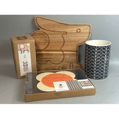 33 - Orla Kiely lot including chopping board, vase, new wooden desk pots and new placemats / T14