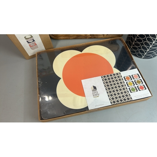 33 - Orla Kiely lot including chopping board, vase, new wooden desk pots and new placemats / T14