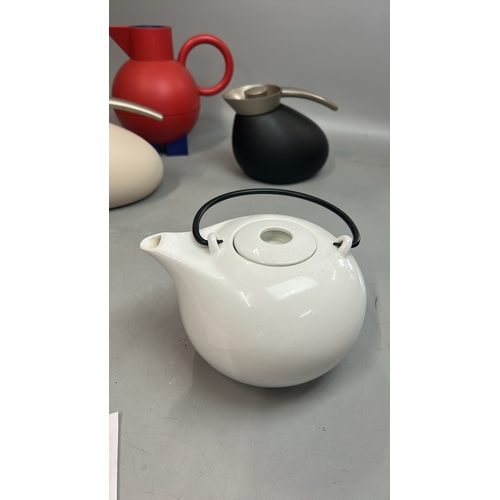 39 - Alessi flask, two Georg Janssen flasks and a ceramic teapot / T17