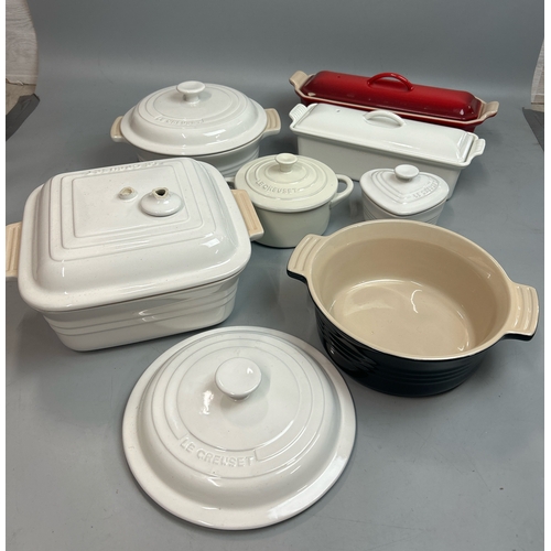 53 - Le Creuset ceramic oven dishes including two tureen's ( one with a chipped lid), large square oven d... 