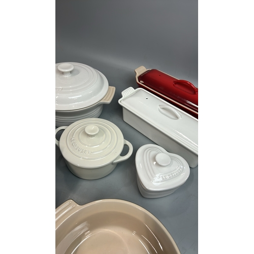 53 - Le Creuset ceramic oven dishes including two tureen's ( one with a chipped lid), large square oven d... 