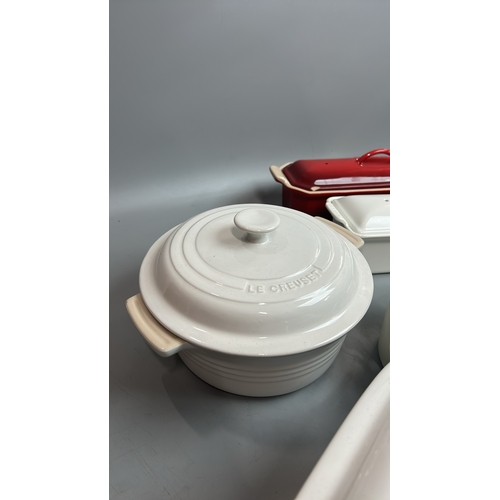 53 - Le Creuset ceramic oven dishes including two tureen's ( one with a chipped lid), large square oven d... 