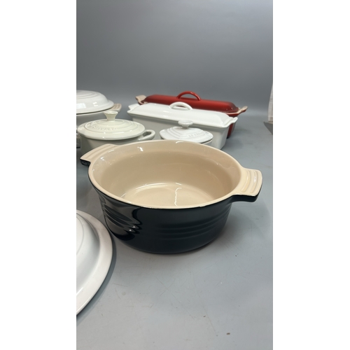 53 - Le Creuset ceramic oven dishes including two tureen's ( one with a chipped lid), large square oven d... 