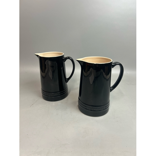 55 - Two Le Creuset jugs, 20cm high / T27