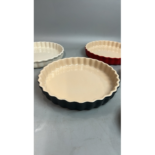 57 - Five Le Creuset flan dishes largest, 26cm diameter / T28