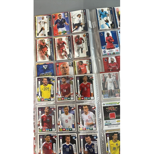 23 - A large collection of assorted football cards in four folders including Shoot Out, Match Attax and P... 