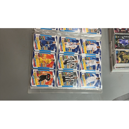 24 - Four folders of assorted football cards including chrome cards. Viewing recommended on request / AN1... 