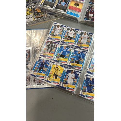 24 - Four folders of assorted football cards including chrome cards. Viewing recommended on request / AN1... 