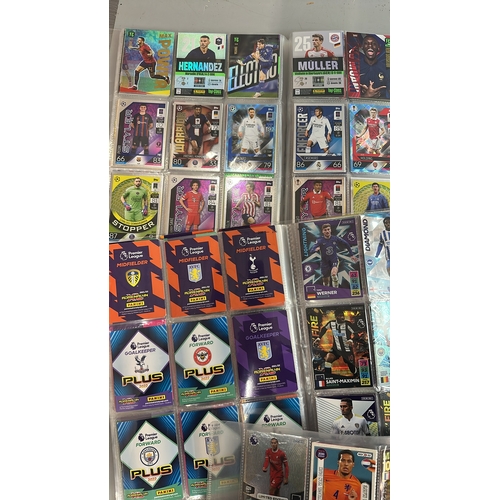 26 - A large collection of assorted football cards in five folders including Match Attax and Panini, with... 