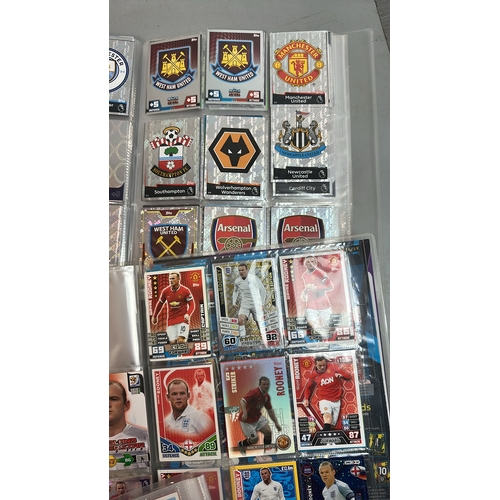 26 - A large collection of assorted football cards in five folders including Match Attax and Panini, with... 