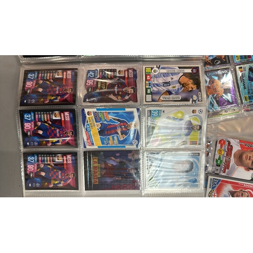 26 - A large collection of assorted football cards in five folders including Match Attax and Panini, with... 