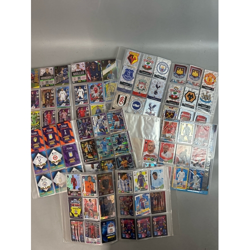 26 - A large collection of assorted football cards in five folders including Match Attax and Panini, with... 