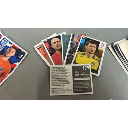 28 - Assorted Football stickers and cards including Panini and  Topps /AN19