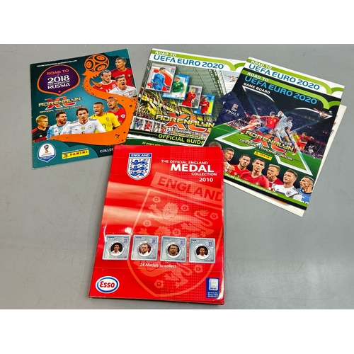 36 - Official England 2010 Team medal collection with other world cup related booklets /AN20