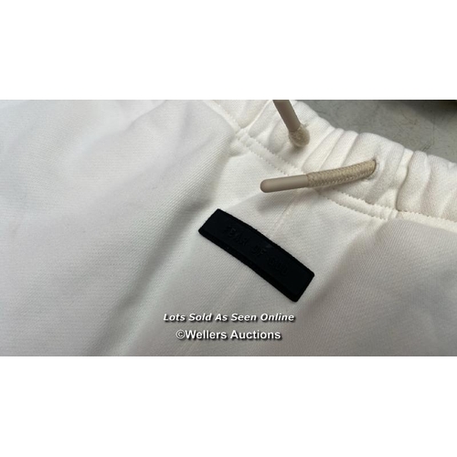 8173 - RRP: 84.95 - FEAR OF GOD ESSENTIALS LOGO SWEATPANTS / 12 / CLOUD DANCER / MINIMAL SIGNS OF USE / G61