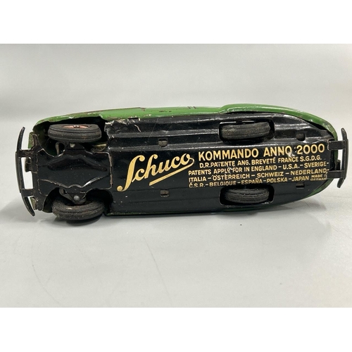 Schuco - two German tinplate clockwork cars including a 1930's