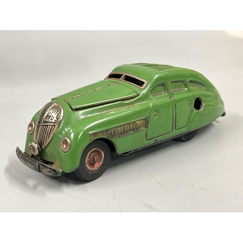 Schuco - two German tinplate clockwork cars including a 1930's