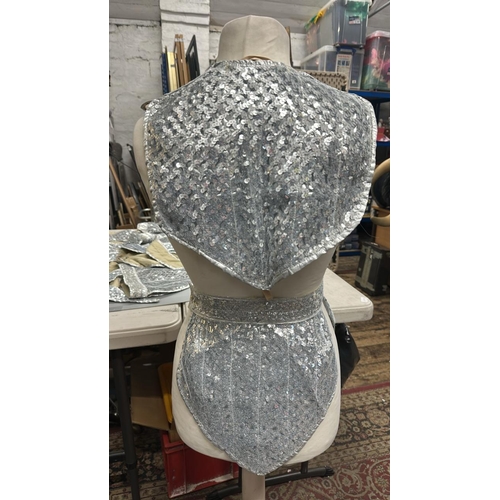 11 - Five cosmic 'Barbarella' style costumes with gauntlets. Rail 1