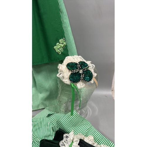 19 - Six typical 'Dirndl' style Bavarian dresses with three headdresses.