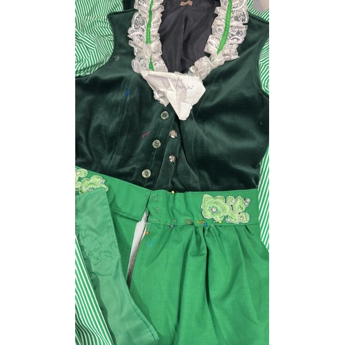 19 - Six typical 'Dirndl' style Bavarian dresses with three headdresses.