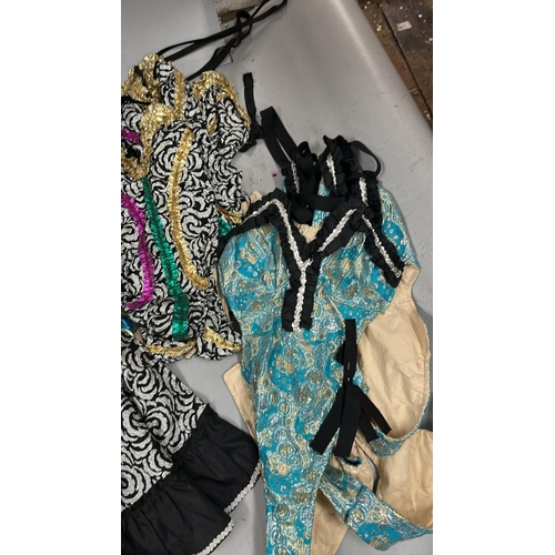 37 - Assorted Can-Can dancer costumes comprising seven bodysuits and four skirts / Rail 3