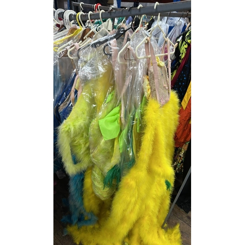 76 - Ten stage used showgirl yellow / yellow & green feather back pieces / Rail 4