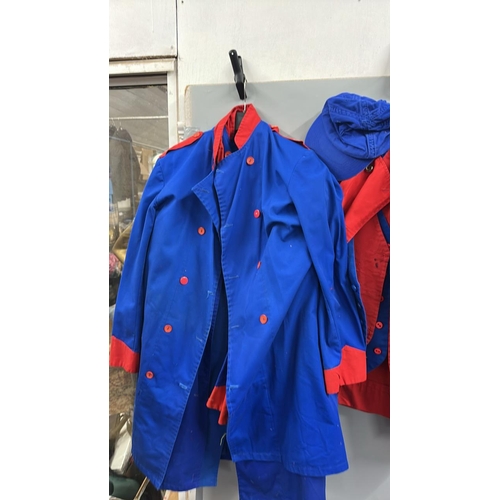 87 - A collection of 'stage worn' military style circus costume 3/4 length jackets, jackets, trousers and... 