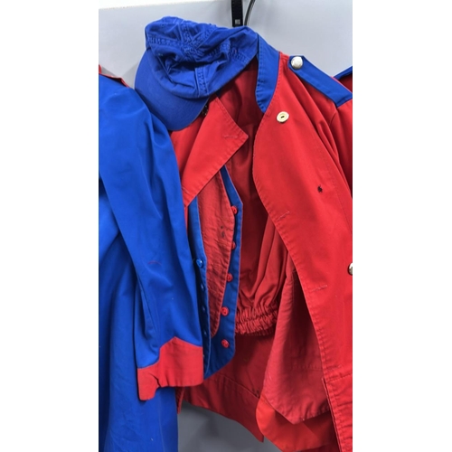 87 - A collection of 'stage worn' military style circus costume 3/4 length jackets, jackets, trousers and... 