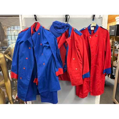 87 - A collection of 'stage worn' military style circus costume 3/4 length jackets, jackets, trousers and... 