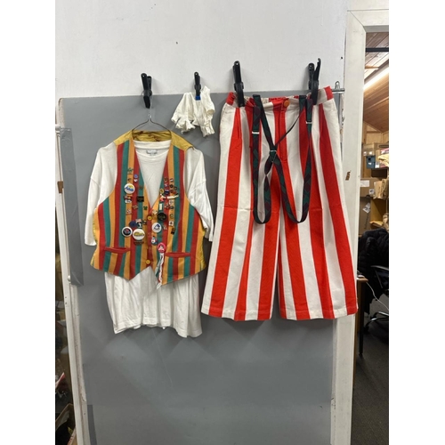 119 - Stage worn clown costume to include waistcoat with assorted pin badges, oversize shorts with braces,... 