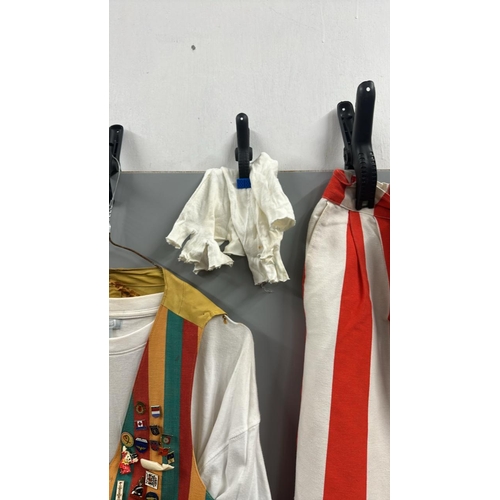 119 - Stage worn clown costume to include waistcoat with assorted pin badges, oversize shorts with braces,... 