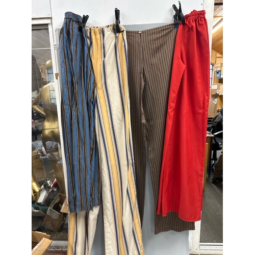 91 - Four pairs of 'stage worn' oversized stilt walkers trousers, longest 2 metres. /Rail 4