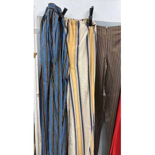91 - Four pairs of 'stage worn' oversized stilt walkers trousers, longest 2 metres. /Rail 4