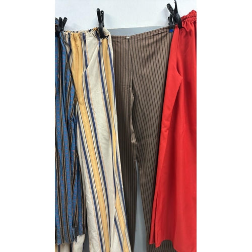 91 - Four pairs of 'stage worn' oversized stilt walkers trousers, longest 2 metres. /Rail 4