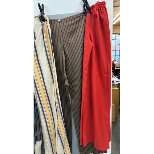 91 - Four pairs of 'stage worn' oversized stilt walkers trousers, longest 2 metres. /Rail 4