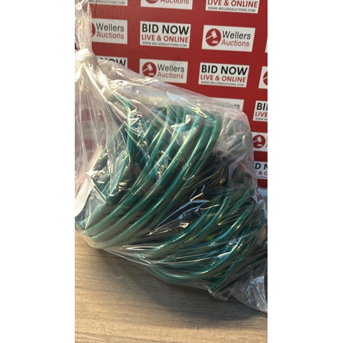 9178 - BAG OF GARDEN HOSES / CW