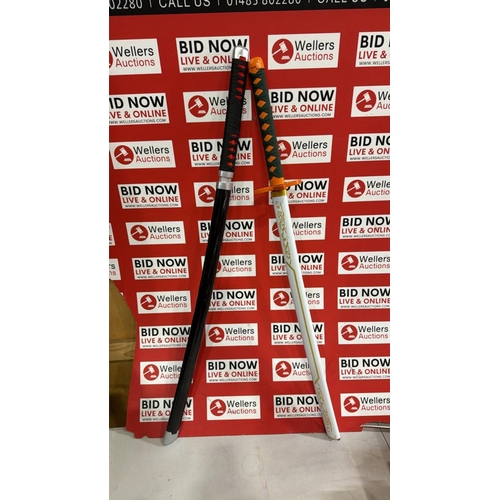 3294 - 2X FAUX SAMURAI SWORDS INC DEMON SLAYER SLIGHT DAMAGE