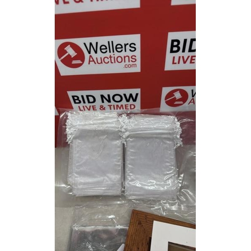 9054 - A HOME AND OFFICE JOBLOT INCLUDING... BUBBLE WRAP, 3 TIER FILING UNIT, 2 BALLS OF WALL, PHOTO FRAME,... 