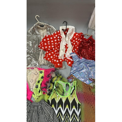 9002 - Selection of stage worn skirts, jackets, tops and dresses / AN113