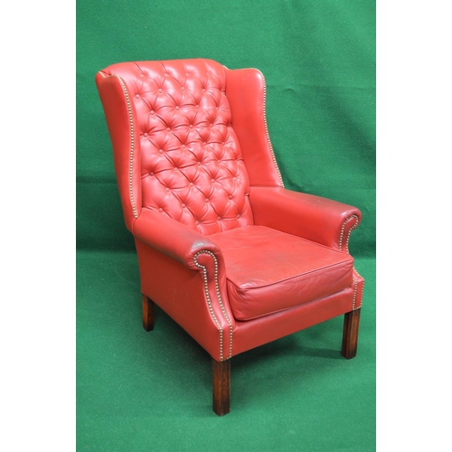 23 - Late 20th century Georgian style red leather wing back armchair having buttoned back and studded win... 