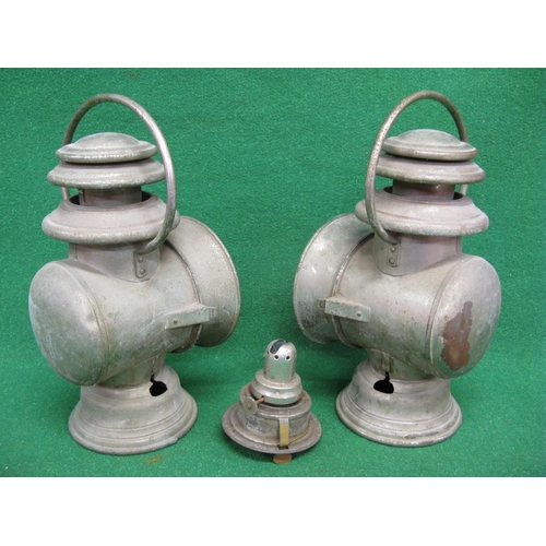 157 - Two French paraffin lamps with side slot mounts and top handles, burners are removed through the bas... 